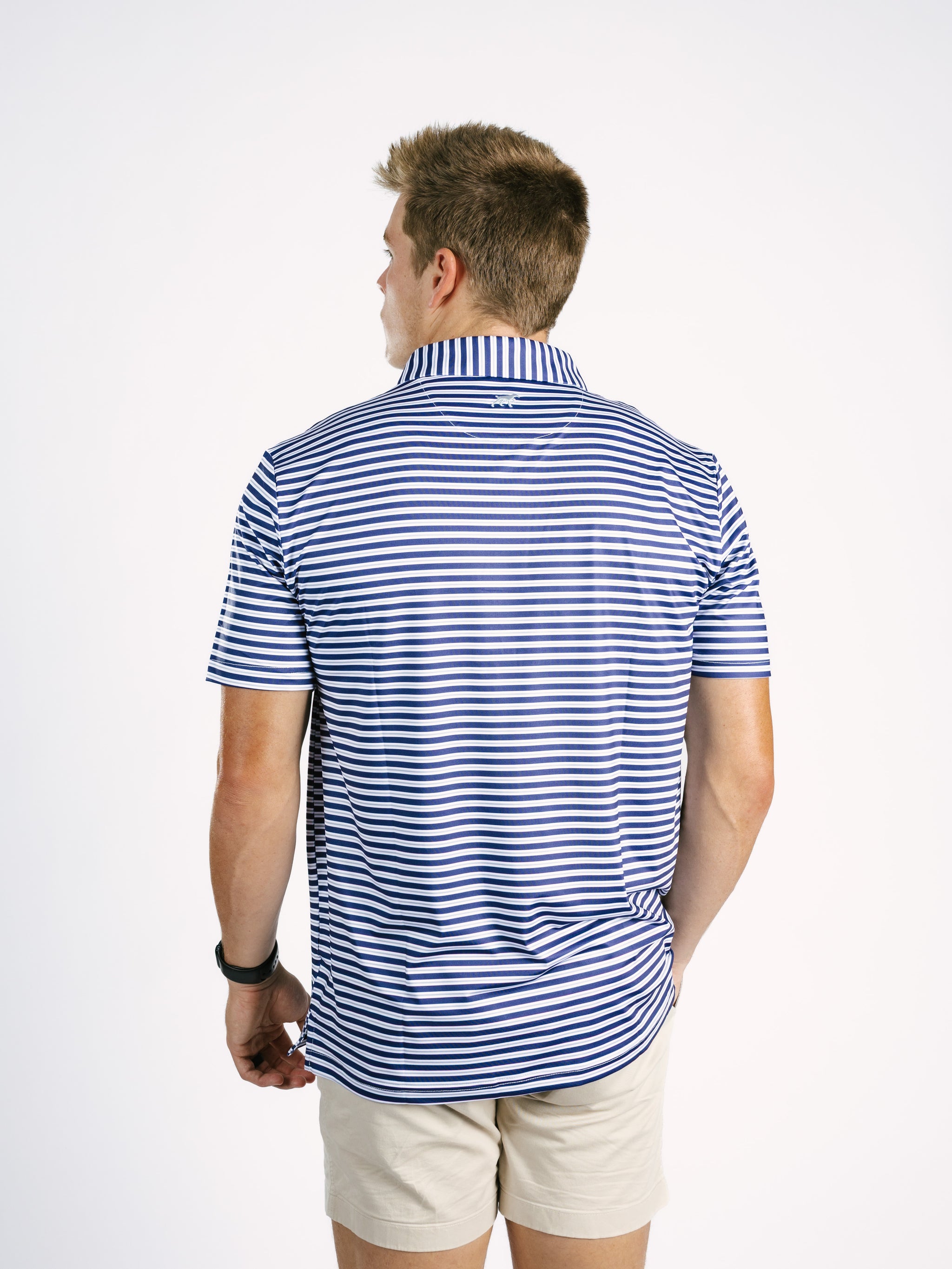 Georgia Southern men's polo shirt with navy and white stripes, branded Arena Graffiti, featuring a classic collar and eagle emblem.