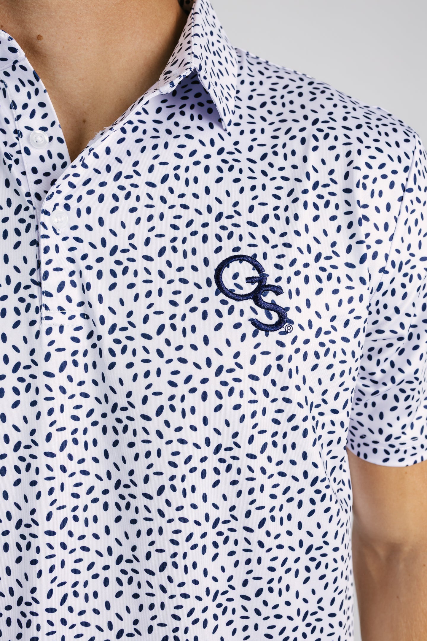 Georgia Southern men's "GS Splatter" polo by Arena Graffiti, featuring a colorful splatter design on a comfortable men's polo shirt.