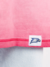Georgia Southern men's pink acid wash tee featuring "Eagles GATA" graphic, by Arena Graffiti, shown on a model.