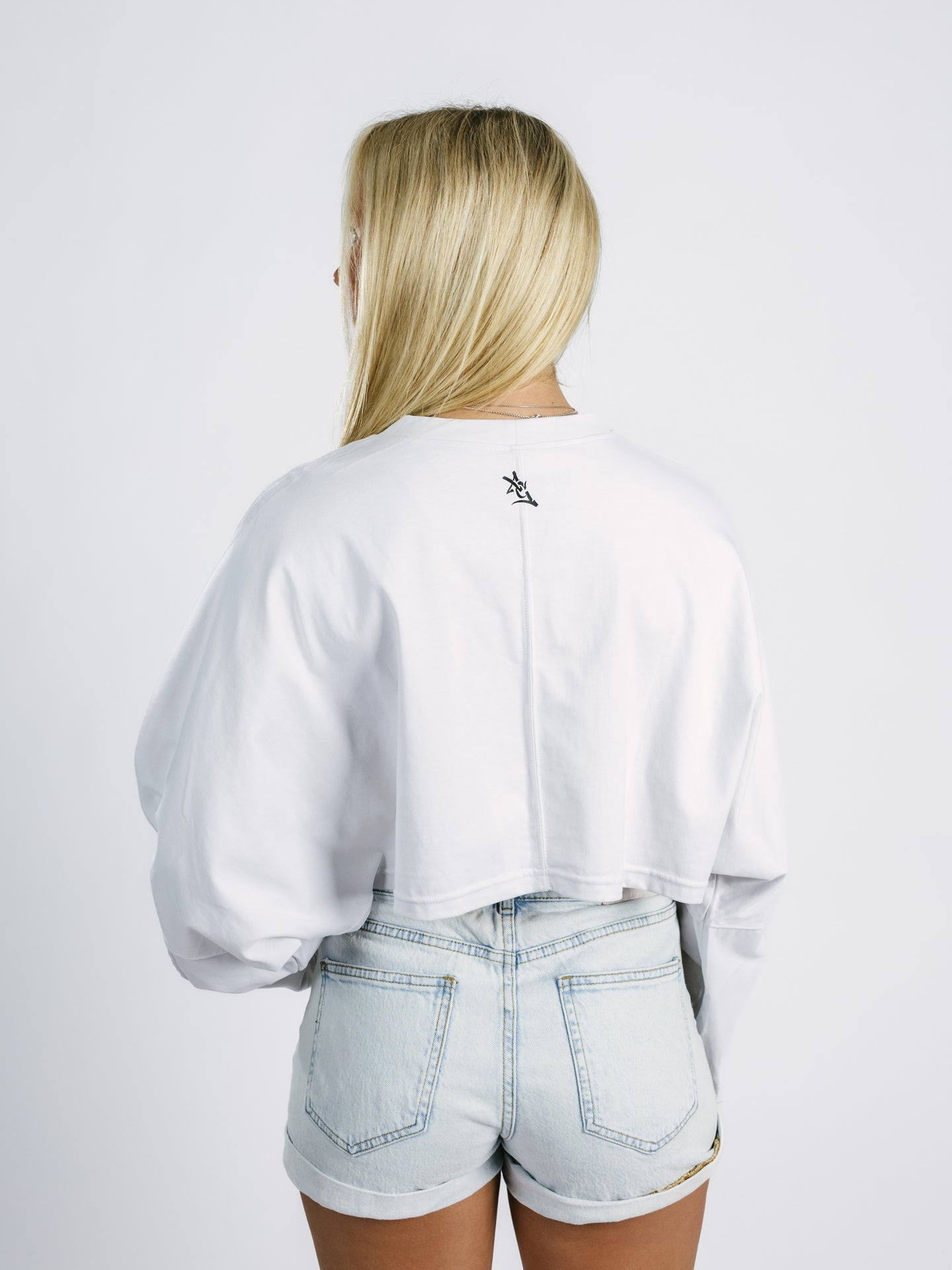 Georgia Southern women's "Eagle Head" long sleeve crop top by Arena Graffiti, featuring a detailed eagle logo on the front.