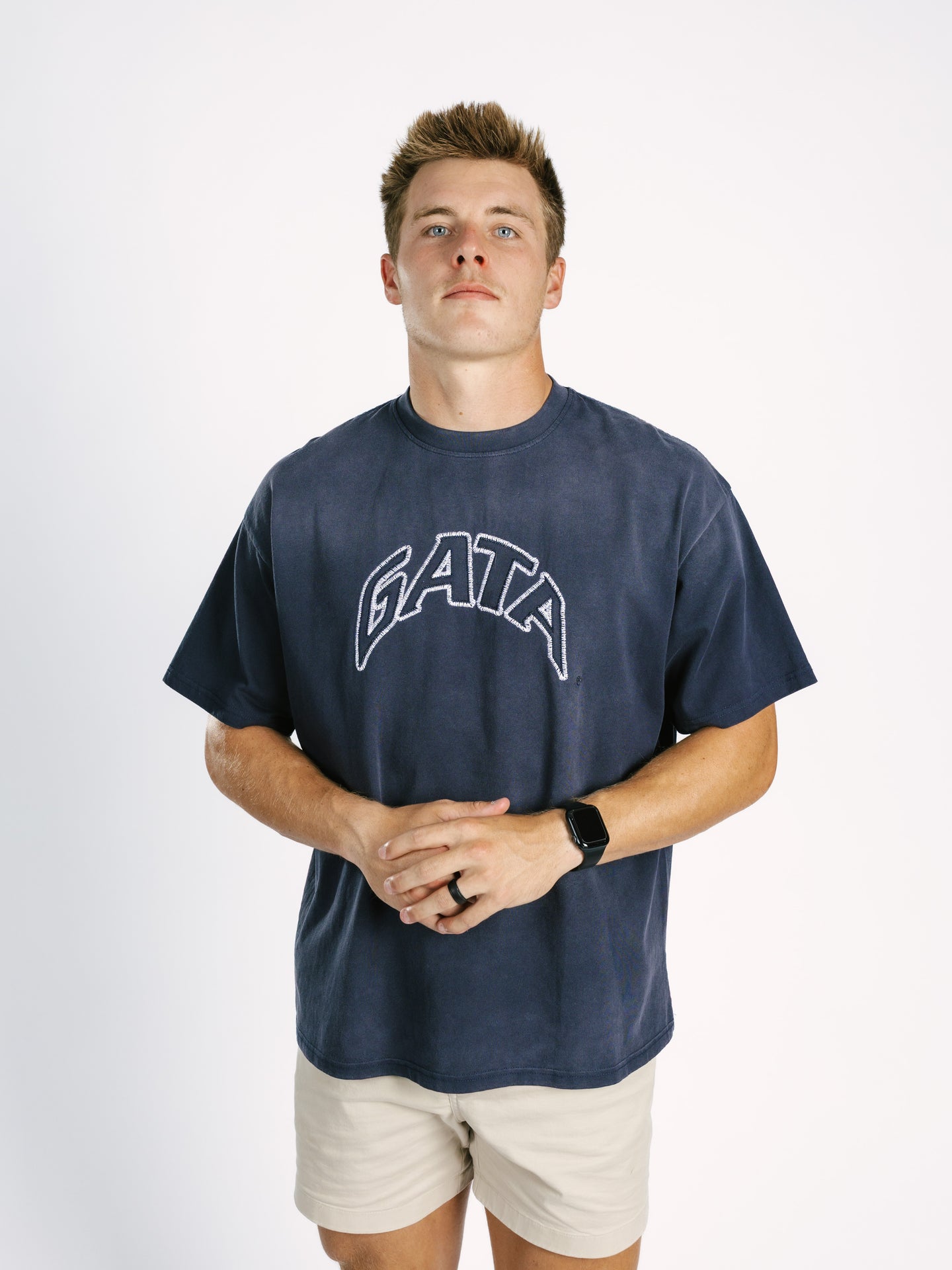 Navy embroidered GATA logo on Arena Graffiti Georgia Southern men's acid wash T-shirt, casual athletic style.