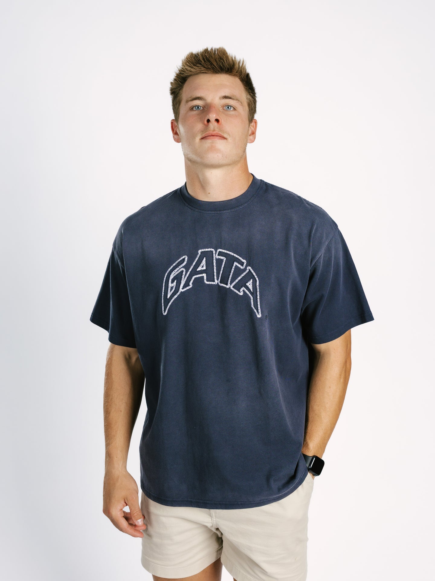 Navy acid wash T-shirt for men featuring embroidered Georgia Southern GATA logo by Arena Graffiti, casual athletic style.