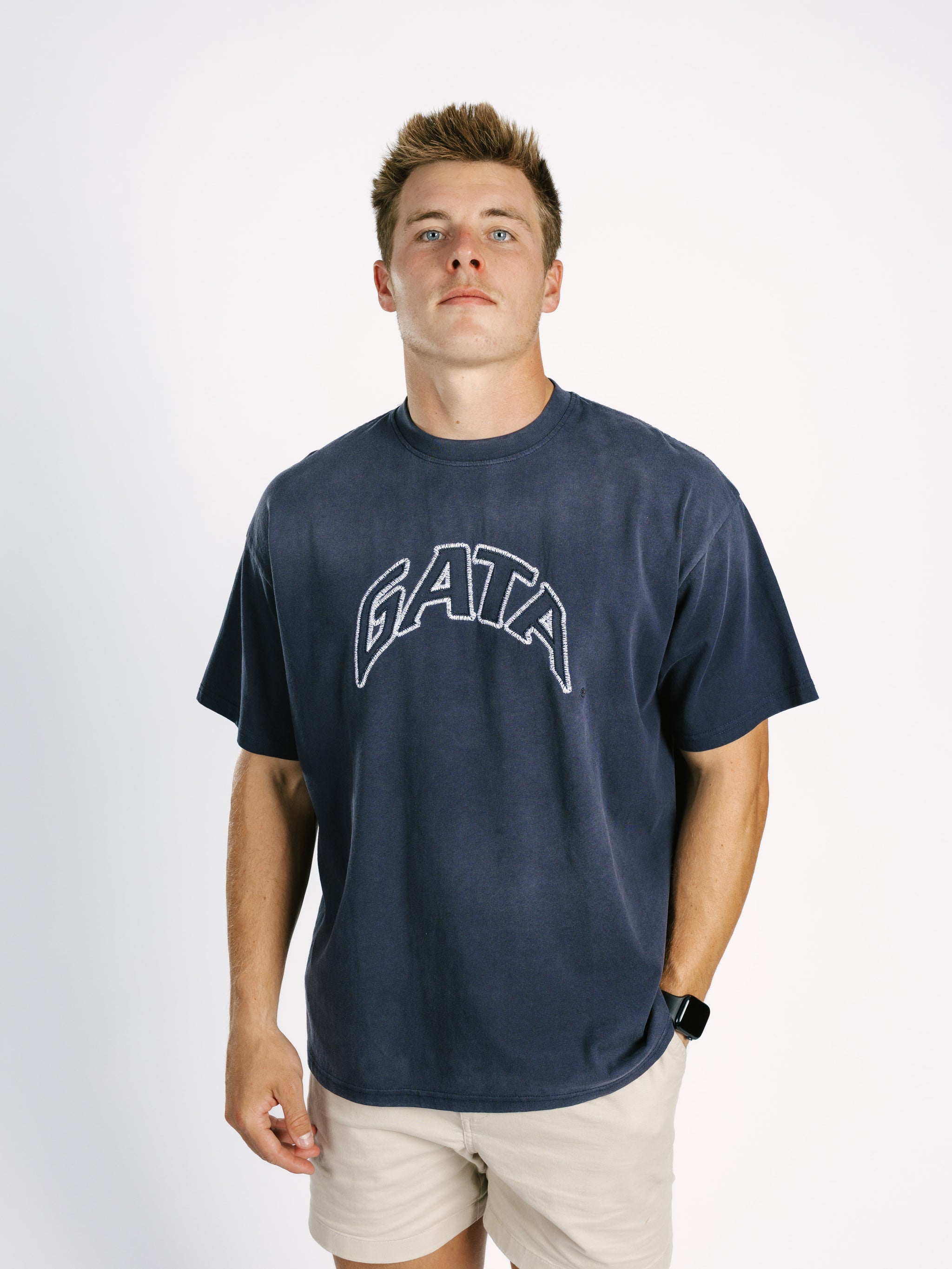 Navy acid wash T-shirt for men featuring embroidered Georgia Southern GATA logo by Arena Graffiti, casual athletic style.