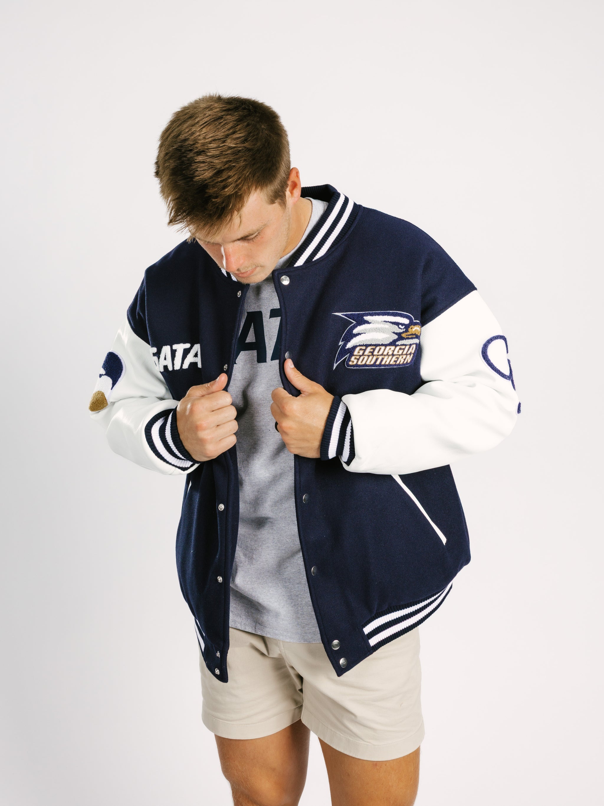 Georgia Southern men's varsity letterman jacket by Arena Graffiti, featuring striped cuffs and embroidered school emblem.