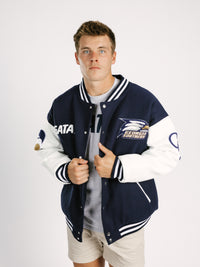 Georgia Southern Men's Varsity Strutter Letterman Jacket by Arena Graffiti, featuring navy blue fabric with embroidered school logo and striped cuffs.