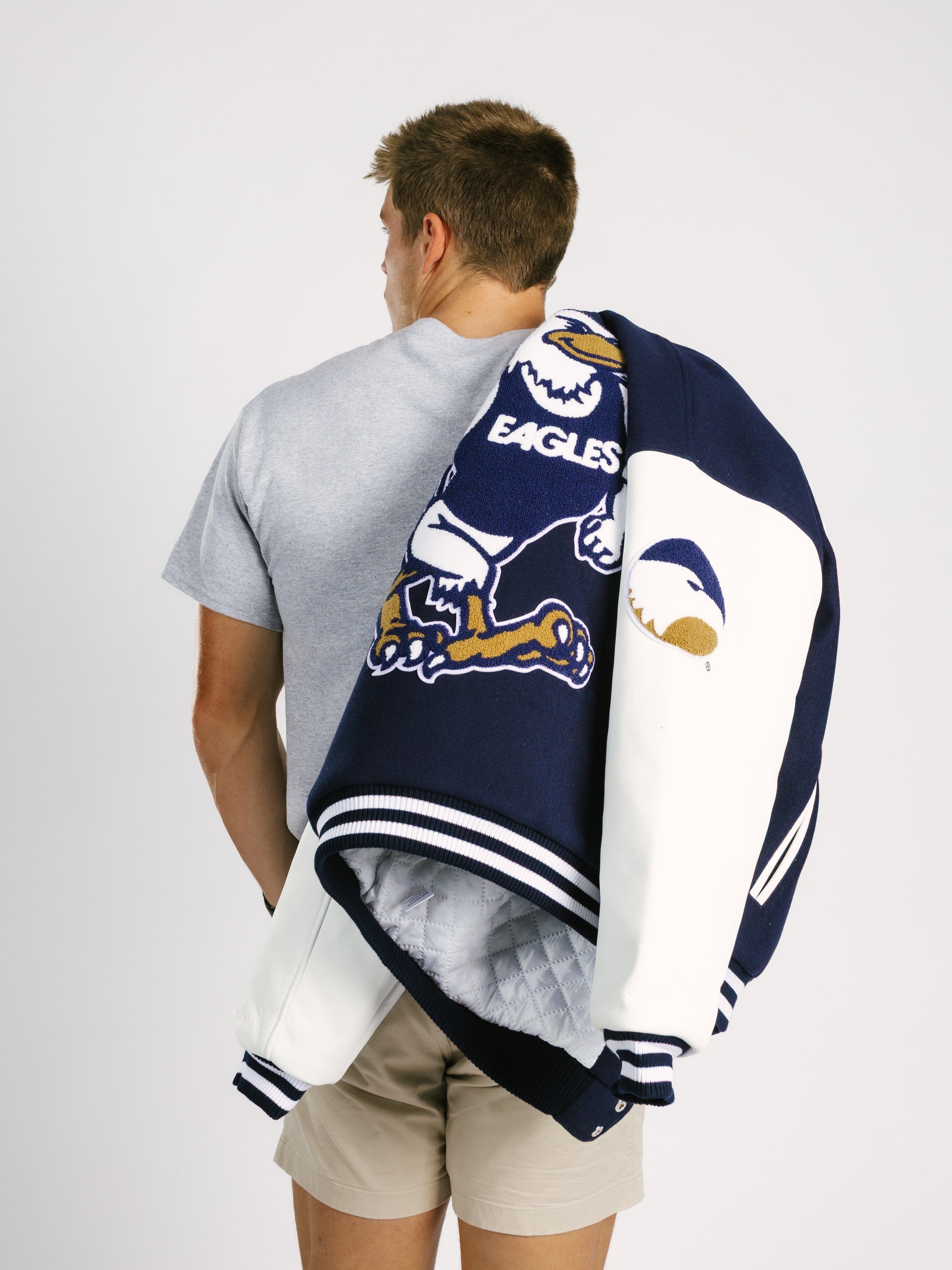 Georgia Southern men's varsity letterman jacket by Arena Graffiti with striped cuffs and embroidered school emblem.