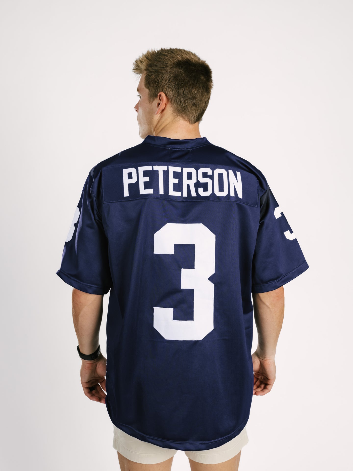 Georgia Southern men's navy jersey by Arena Graffiti featuring "AP" lettering, displayed on a hanger.