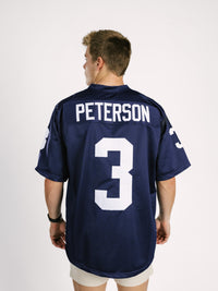Georgia Southern men's navy jersey by Arena Graffiti featuring "AP" lettering, displayed on a hanger.