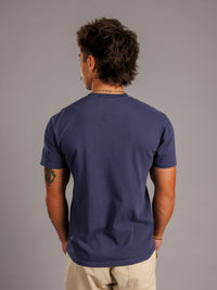 Augusta University men's navy T-shirt featuring the Augusta Jag Head logo, designed by Arena Graffiti.