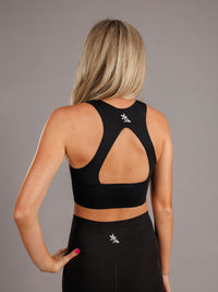 Arena Graffiti Augusta University women's high neck padded active top, featuring a bold "A" logo and athletic fit for active wear.