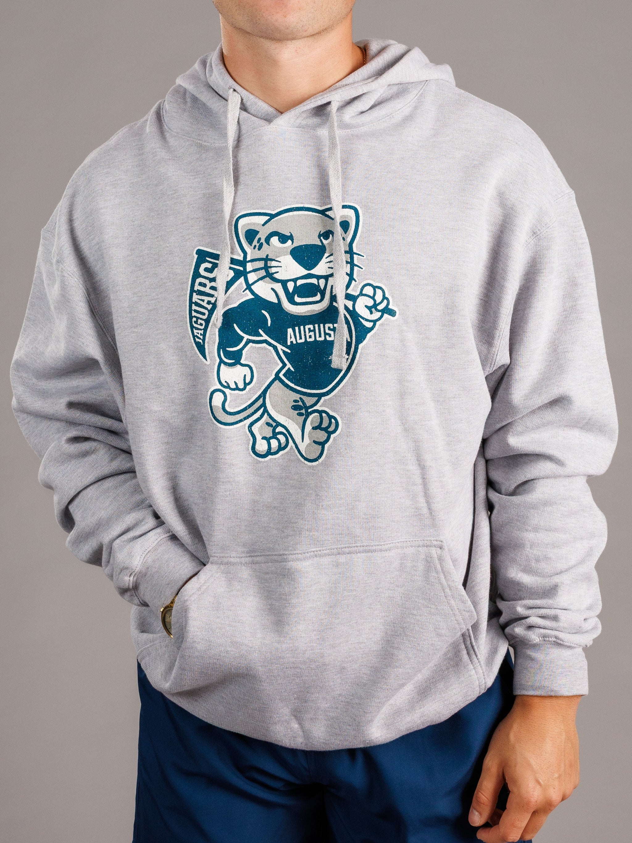 Grey hoodie for men featuring Augusta University "Walking Jag" logo, made by Arena Graffiti, casual and comfortable athletic wear