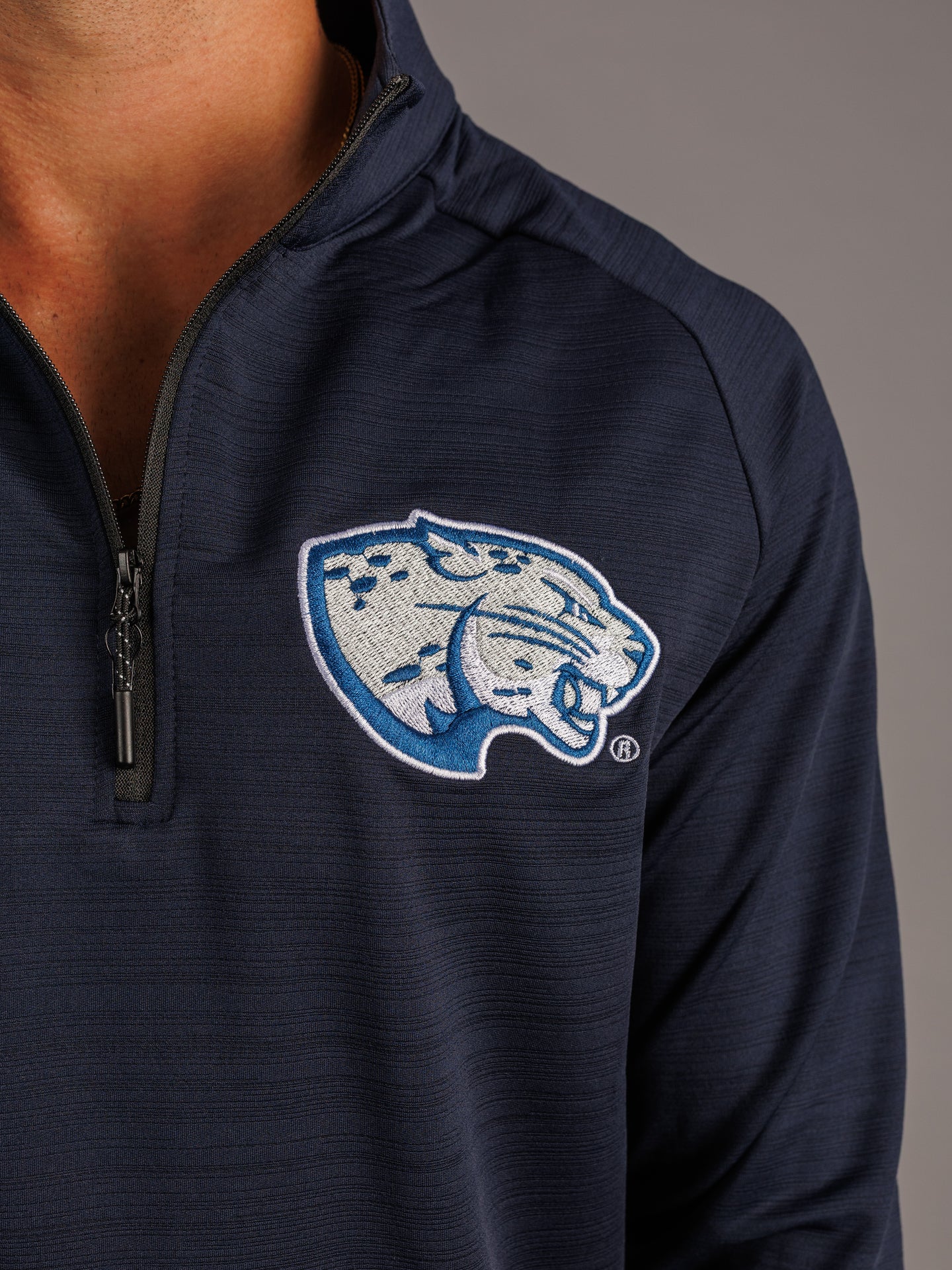 Arena Graffiti Augusta University men's navy quarter zip featuring the "Jag Head" logo on the front.