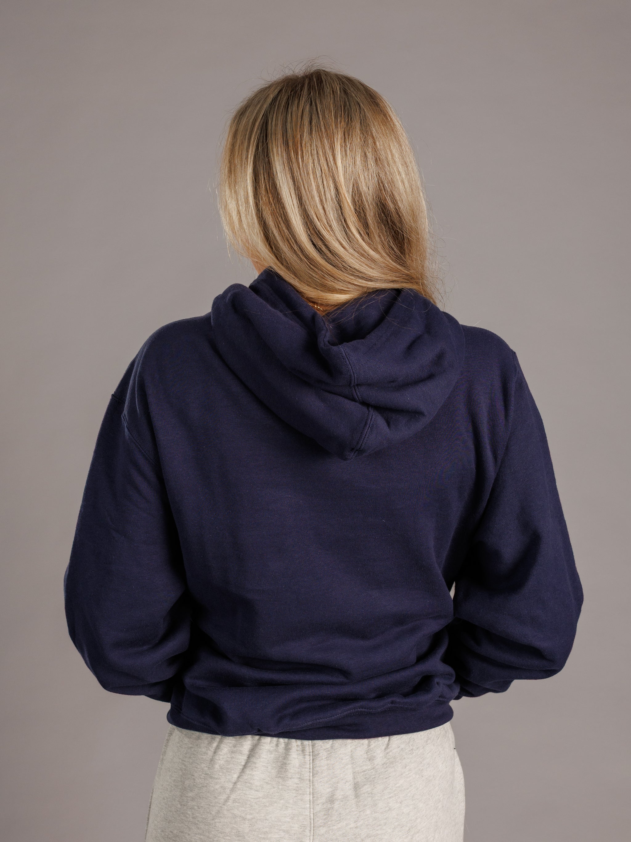 Navy hoodie for men with Augusta University "A" logo, by Arena Graffiti, displayed on a hanger against a plain background.