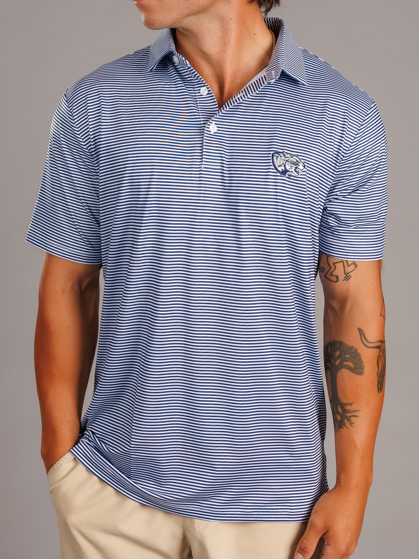 Arena Graffiti Augusta University men's Jag Head striped polo shirt with navy, white, and red horizontal stripes.