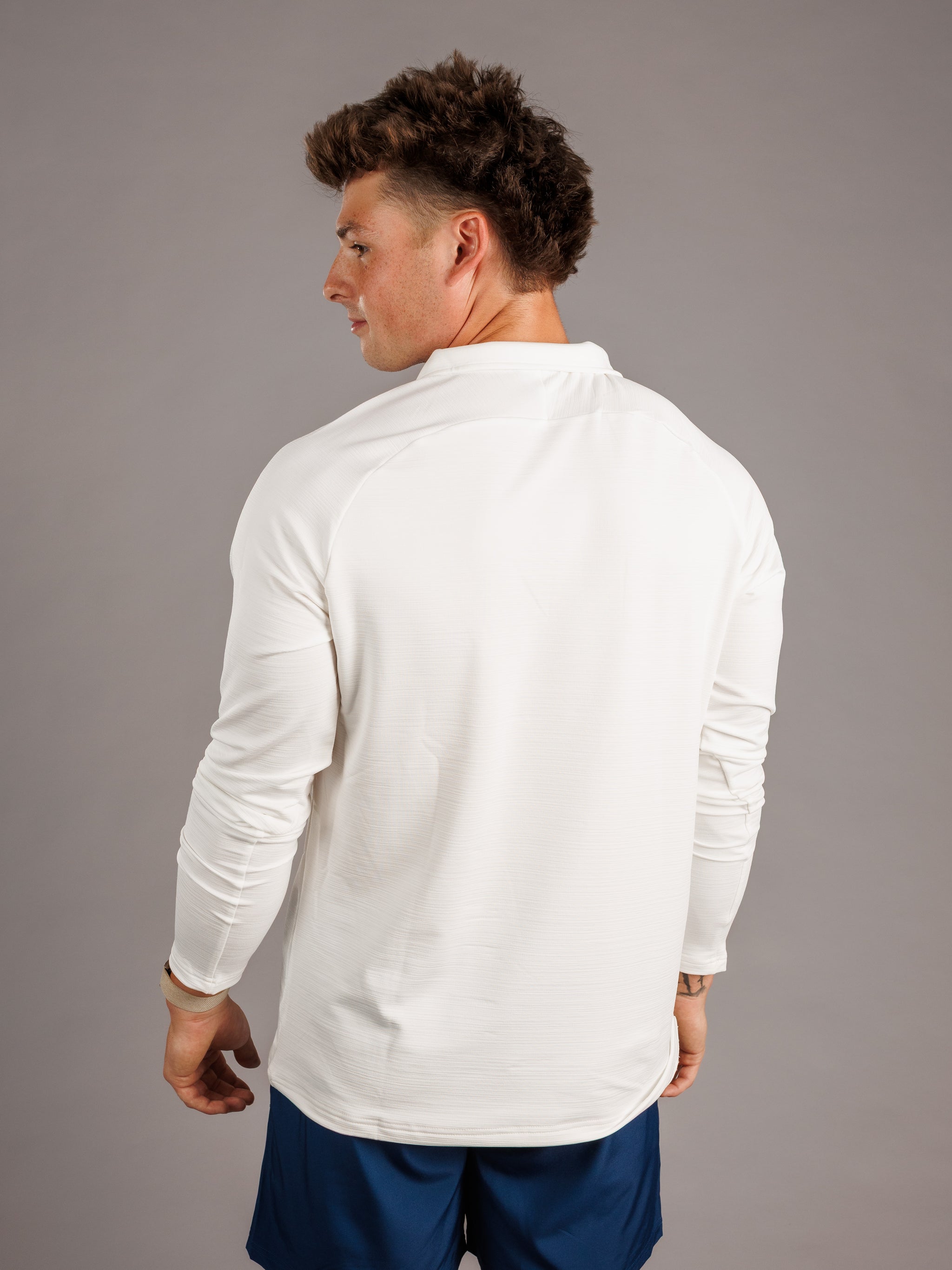 Arena Graffiti Augusta University men's white "Jag Head" quarter zip sweatshirt, featuring university logo and athletic style.