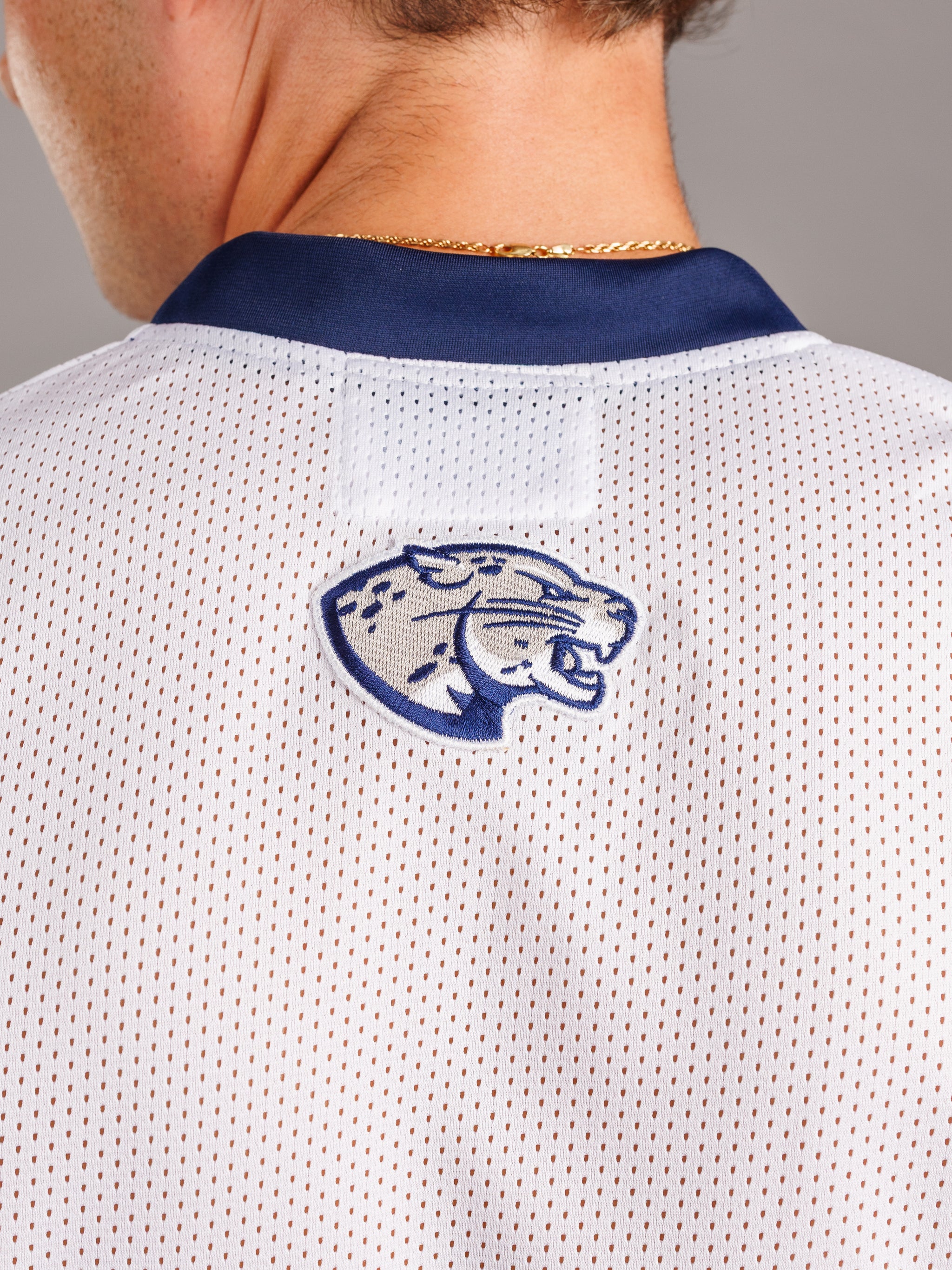 Augusta University men's basketball jersey by Arena Graffiti, featuring a 28 number and team logo on navy fabric.
