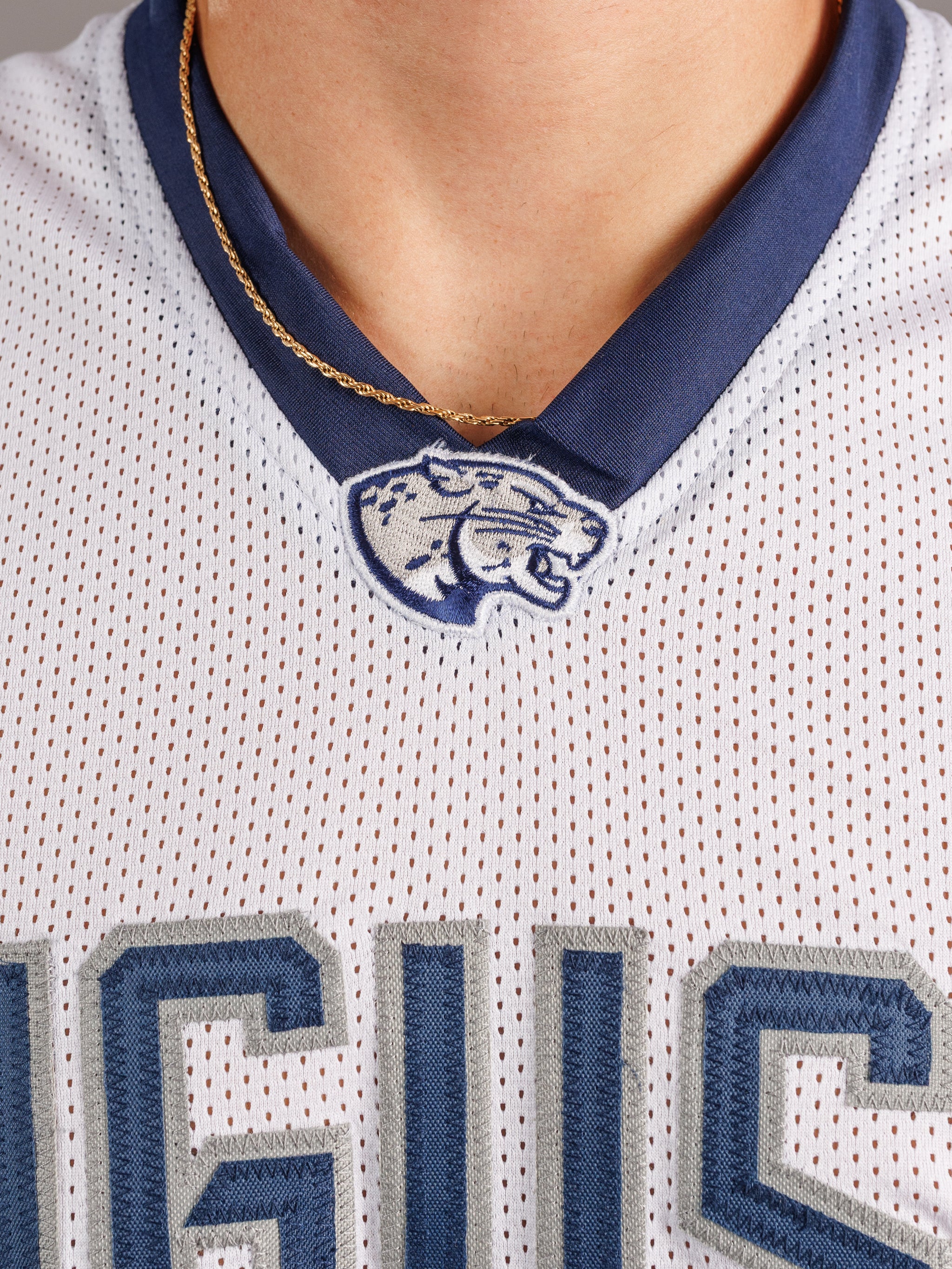 Augusta University men's basketball jersey by Arena Graffiti, navy blue with white number 28 and university logo on front.