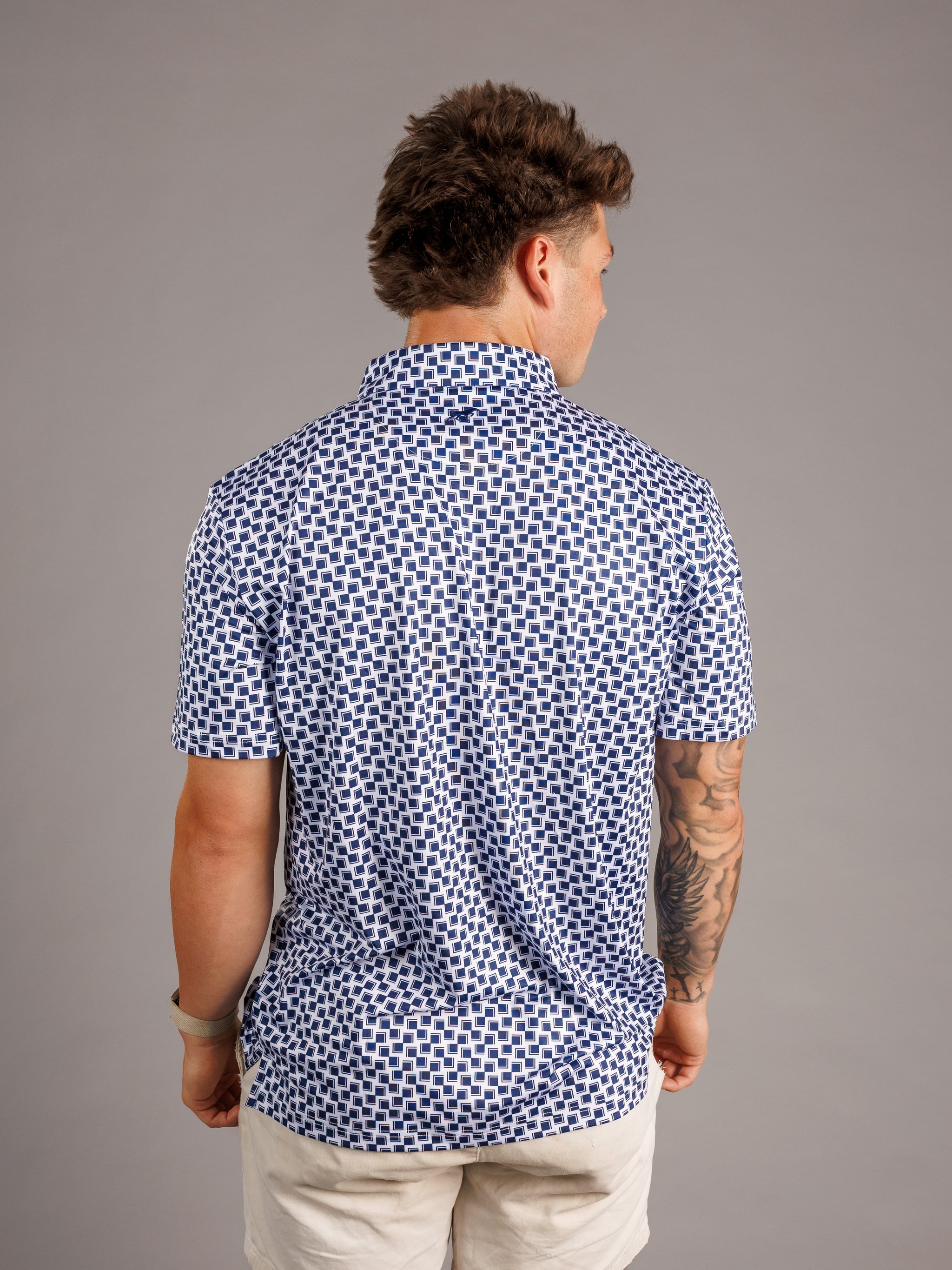 Men's checkered polo shirt by Arena Graffiti featuring Augusta University "A" logo, in a classic "A" checkered pattern.