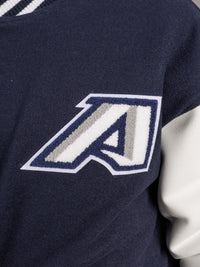 Arena Graffiti Augusta University men's varsity Jag letterman jacket with university crest and striped cuffs, front view.