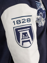 Augusta University men's varsity letterman jacket by Arena Graffiti, navy blue with university logo and letter patches.