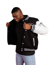 UGA Bulldogs men's Iron Varsity letterman jacket by Arena Graffiti, navy with team emblem and striped cuffs on a model.