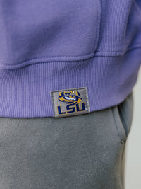 LSU Tigers men's heavyweight crewneck sweatshirt by Arena Graffiti, featuring "LSU" logo and team colors in a close-up shot.