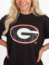 UGA Bulldogs women's Oval Mark tee by Arena Graffiti, featuring a stylish graphic design on a white cotton shirt.