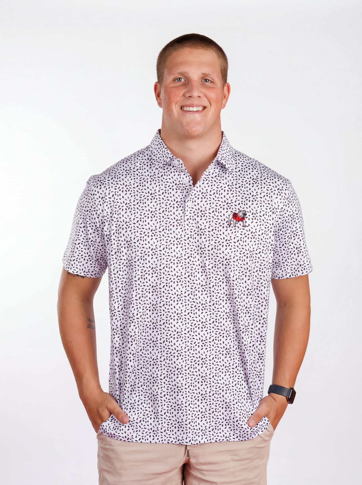 UGA Bulldogs men's black and white "Splatter Dawg" polo shirt by Arena Graffiti, featuring a bold splatter design.