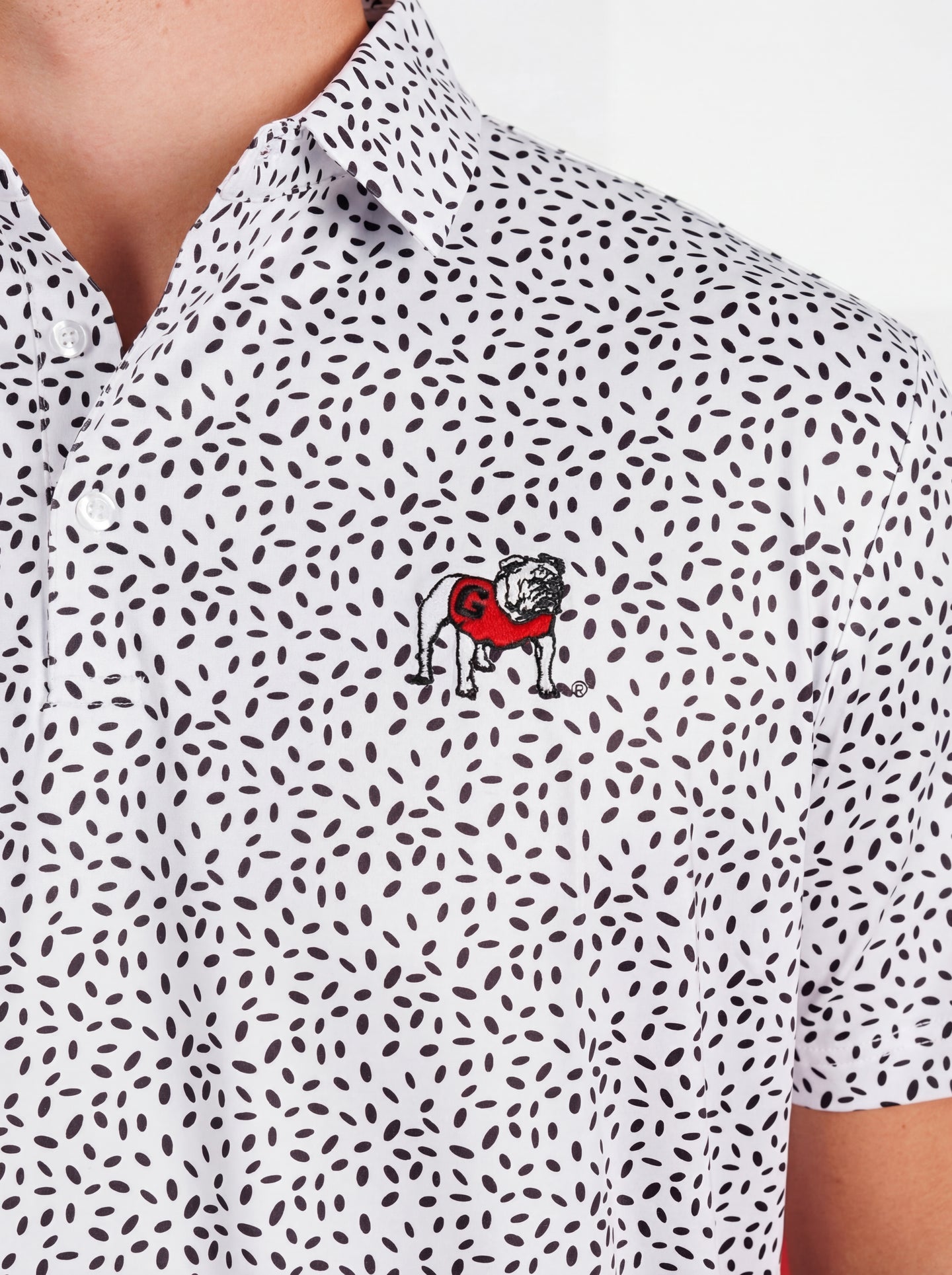 UGA Bulldogs men's black and white "Splatter Dawg" polo shirt by Arena Graffiti, featuring a bold splatter design and team logo.