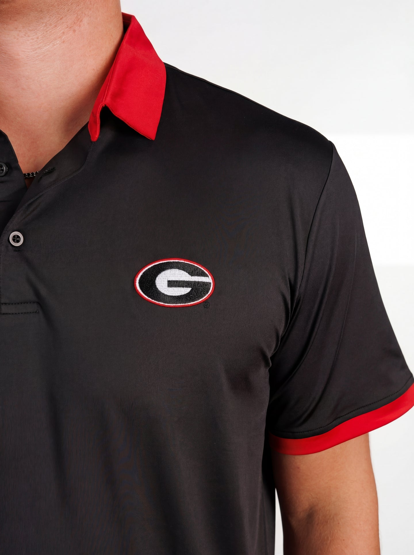 UGA Bulldogs men's red collar polo shirt by Arena Graffiti, featuring the "Red Collar Mark" logo on the chest.