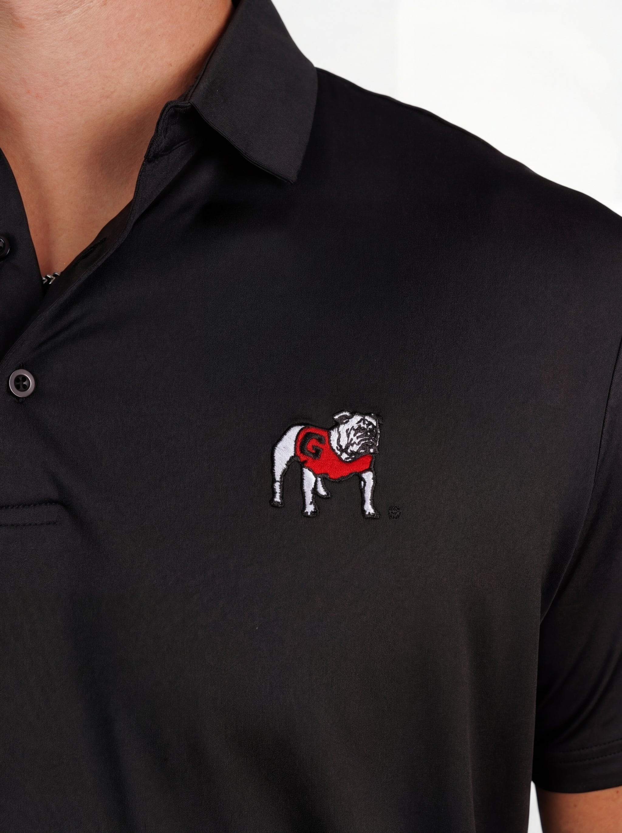 UGA Bulldogs men's Blackout Dawg polo shirt by Arena Graffiti, featuring black fabric and team logo design.