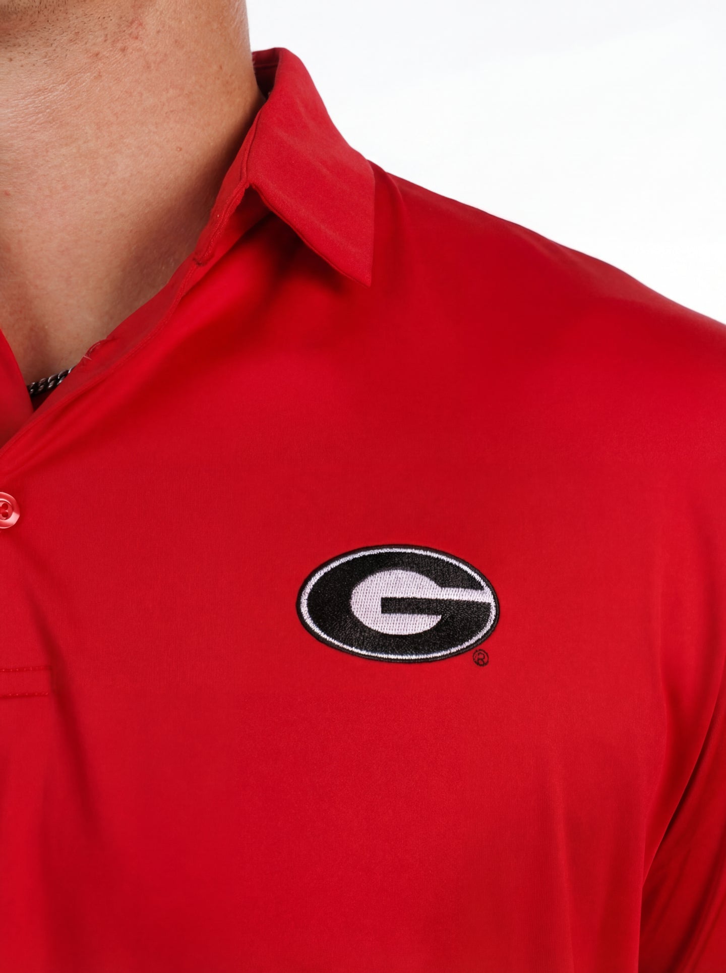 UGA Bulldogs men's red "Hedges" polo shirt by Arena Graffiti, featuring a classic collar and Bulldogs logo on the chest.