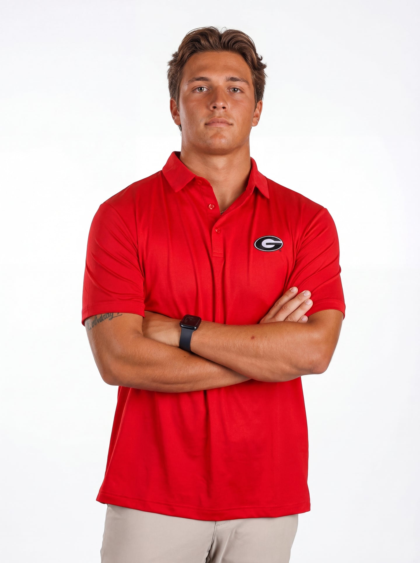 UGA Bulldogs men's red "Hedges" polo shirt by Arena Graffiti, featuring the team logo and classic collar design.