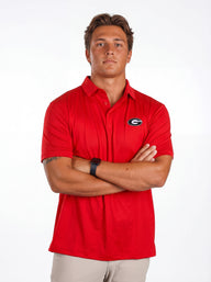 UGA Bulldogs men's red "Hedges" polo shirt by Arena Graffiti, featuring the team logo and classic collar design.