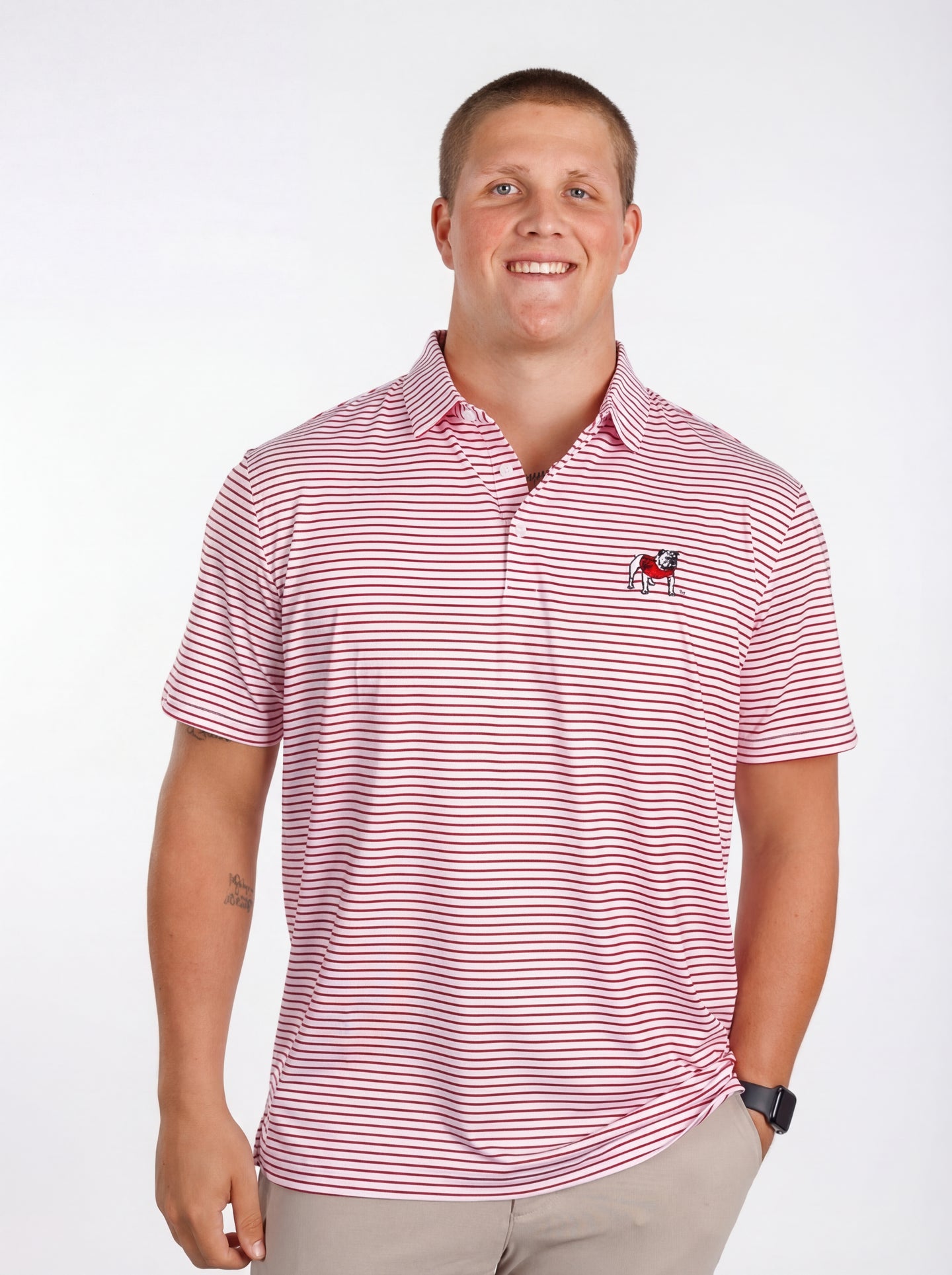 UGA Bulldogs men's "Standing Dawg" red and white striped polo shirt by Arena Graffiti, featuring the team logo and classic collar.