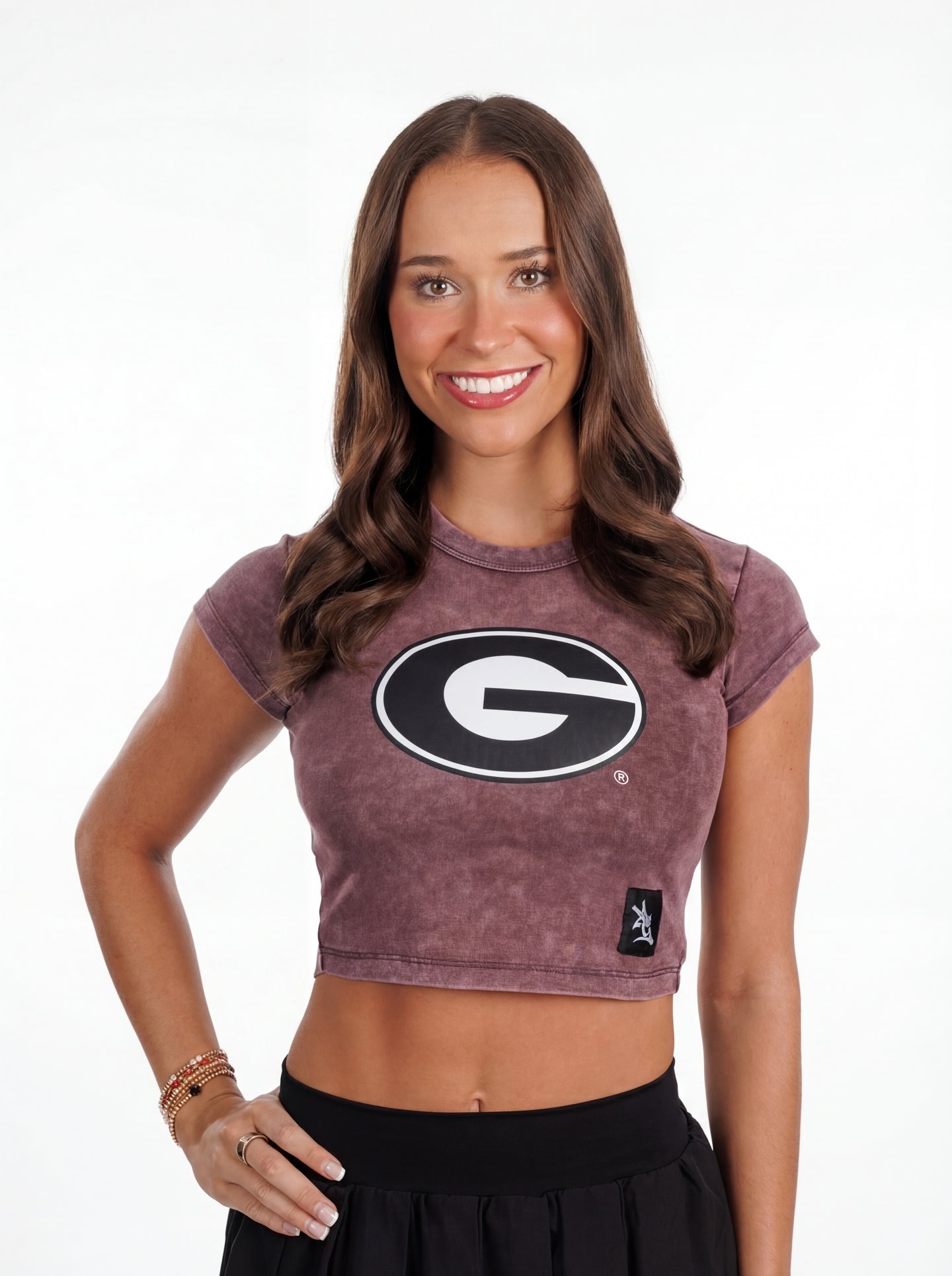 UGA Bulldogs women’s Violet Mark crop top by Arena Graffiti, featuring team logo and vibrant purple fabric, casual athletic style