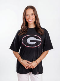UGA Bulldogs women's "Reverse G" T-shirt by Arena Graffiti featuring a bold graphic design and team logo on white fabric.