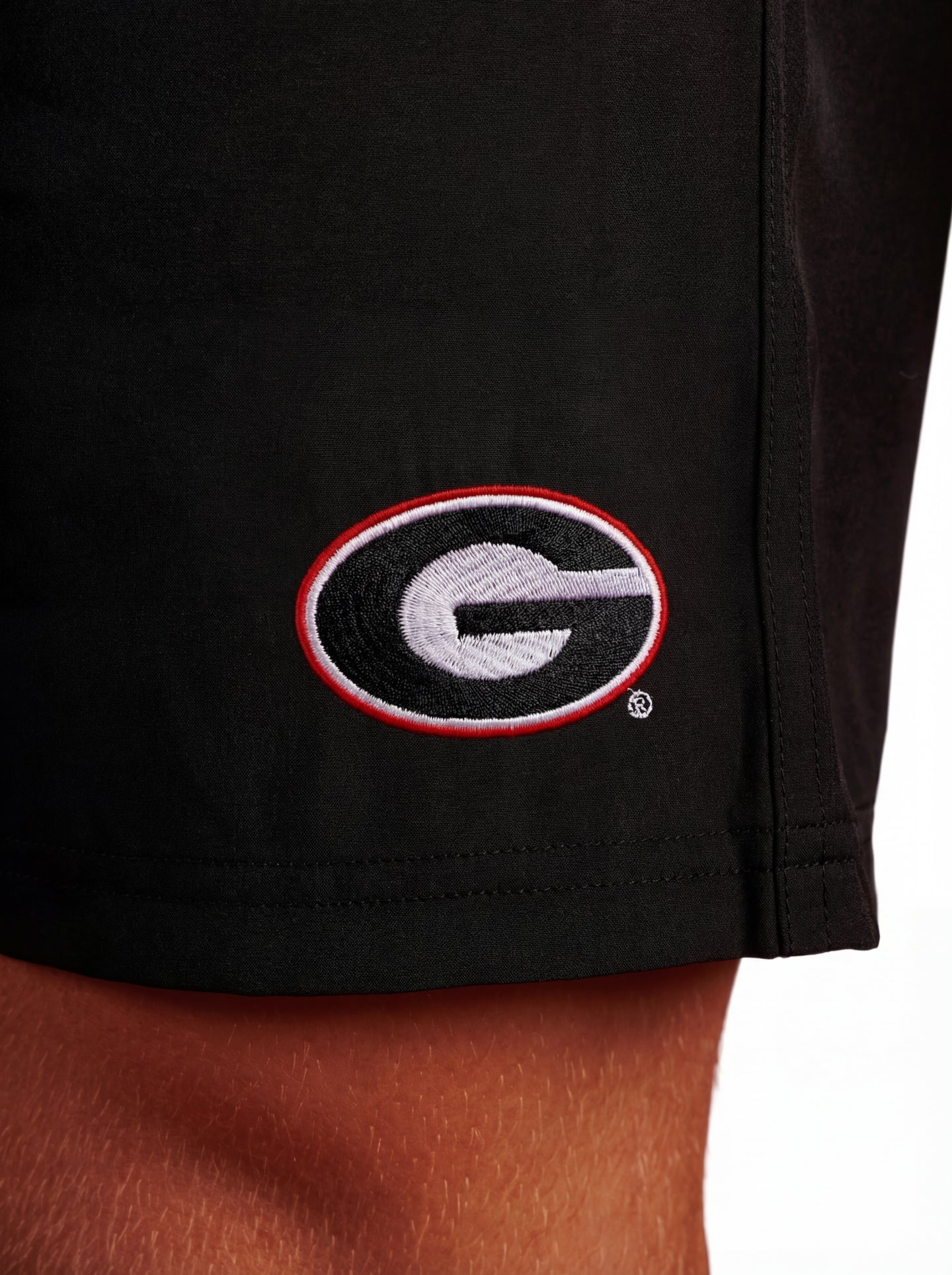 Black UGA Bulldogs men's shorts with Arena Graffiti "Oval G" logo, featuring a comfortable fit and athletic style.