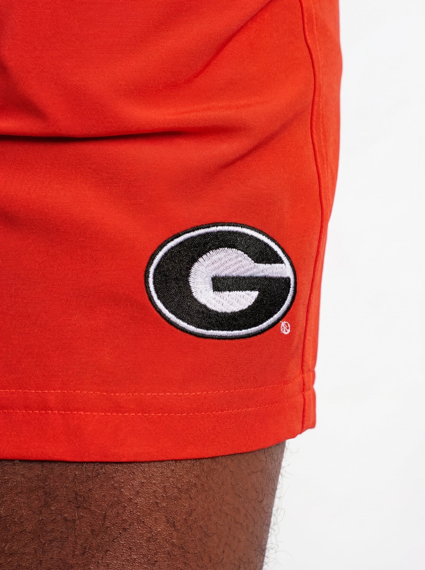 UGA Bulldogs men's "True Dawg" shorts by Arena Graffiti featuring team logo and athletic fit, in navy and red fabric.