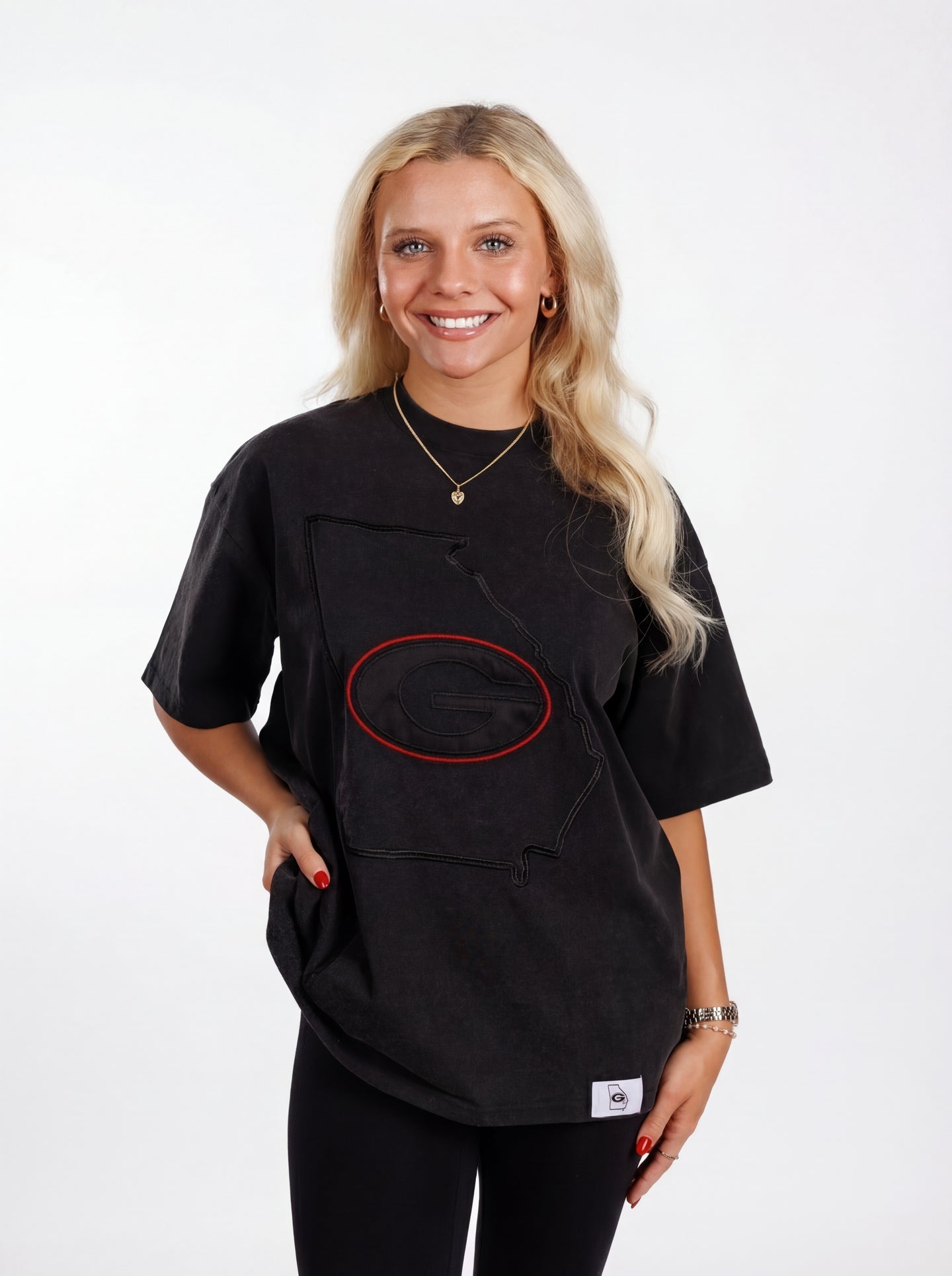UGA Bulldogs women’s “Reverse State” tee by Arena Graffiti showing a casual fit with a graphic design of Georgia state outline in black and red.
