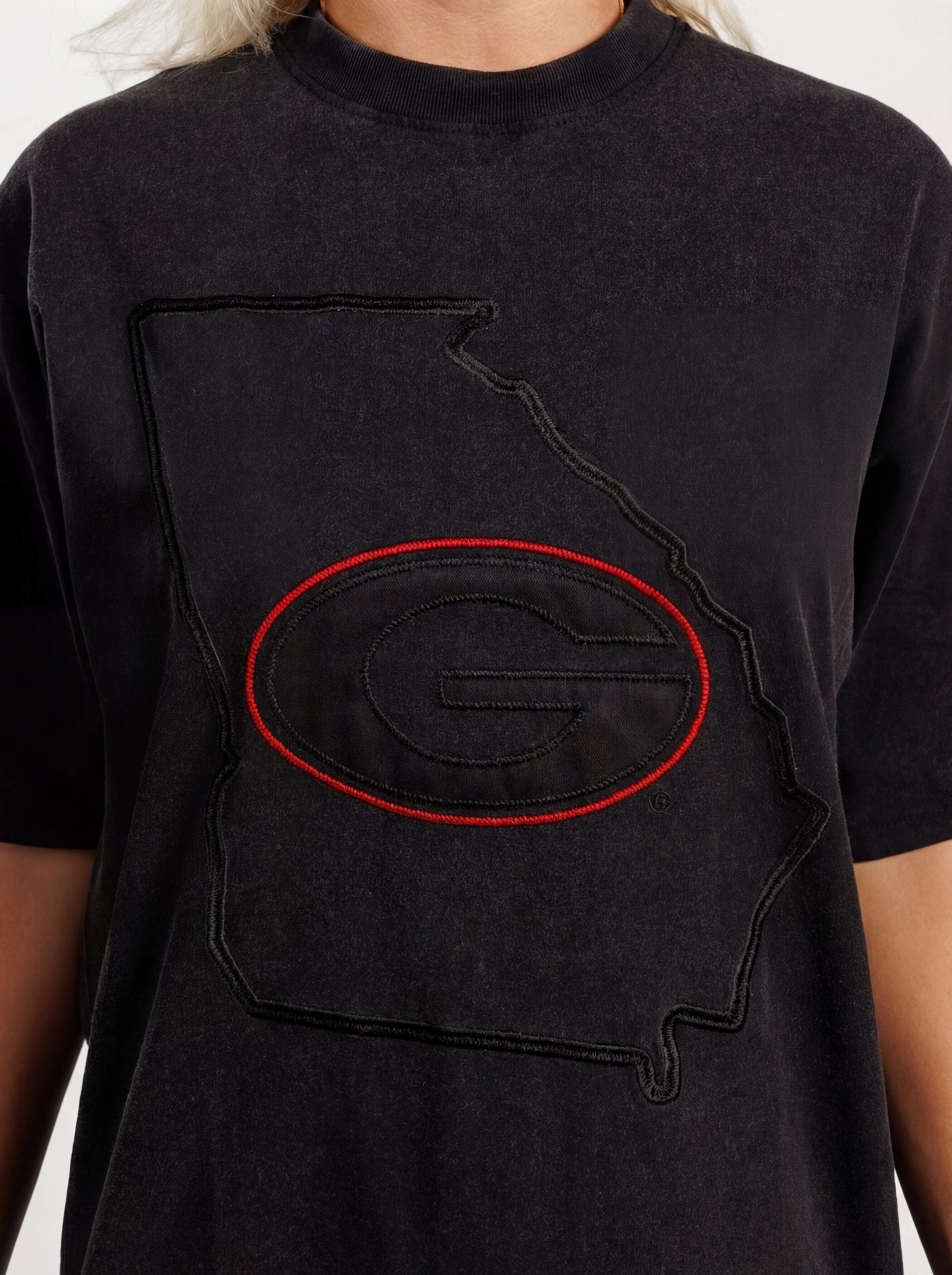 UGA Bulldogs women’s “Reverse State” tee by Arena Graffiti featuring a graphic design of the Georgia state outline on white fabric