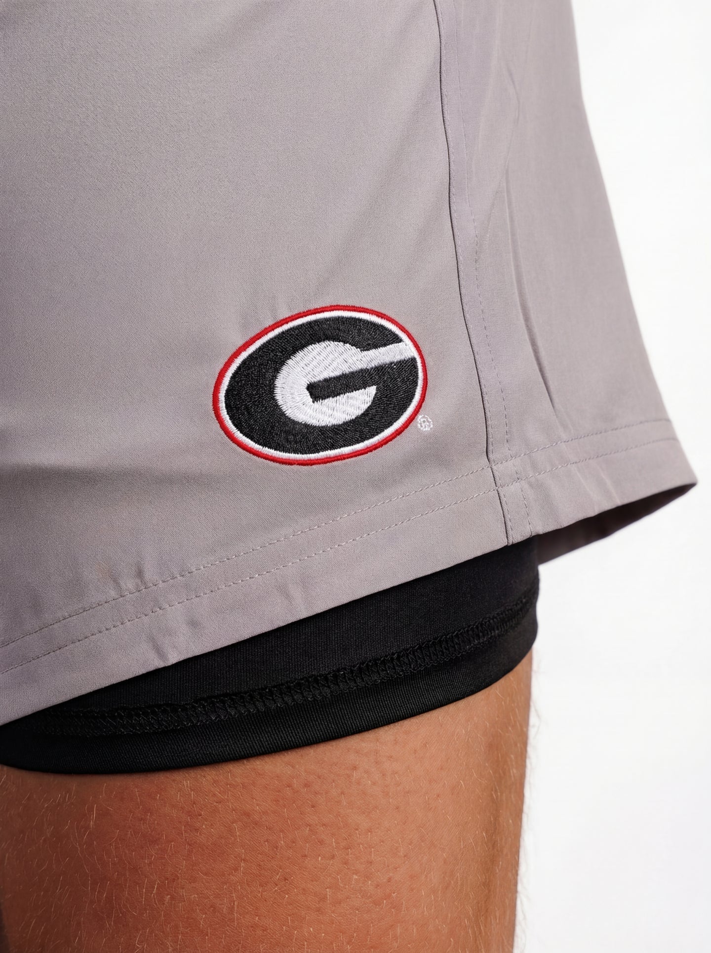 UGA Bulldogs men's Oval G shorts by Arena Graffiti, featuring team logo and athletic design, black fabric with blue accents.