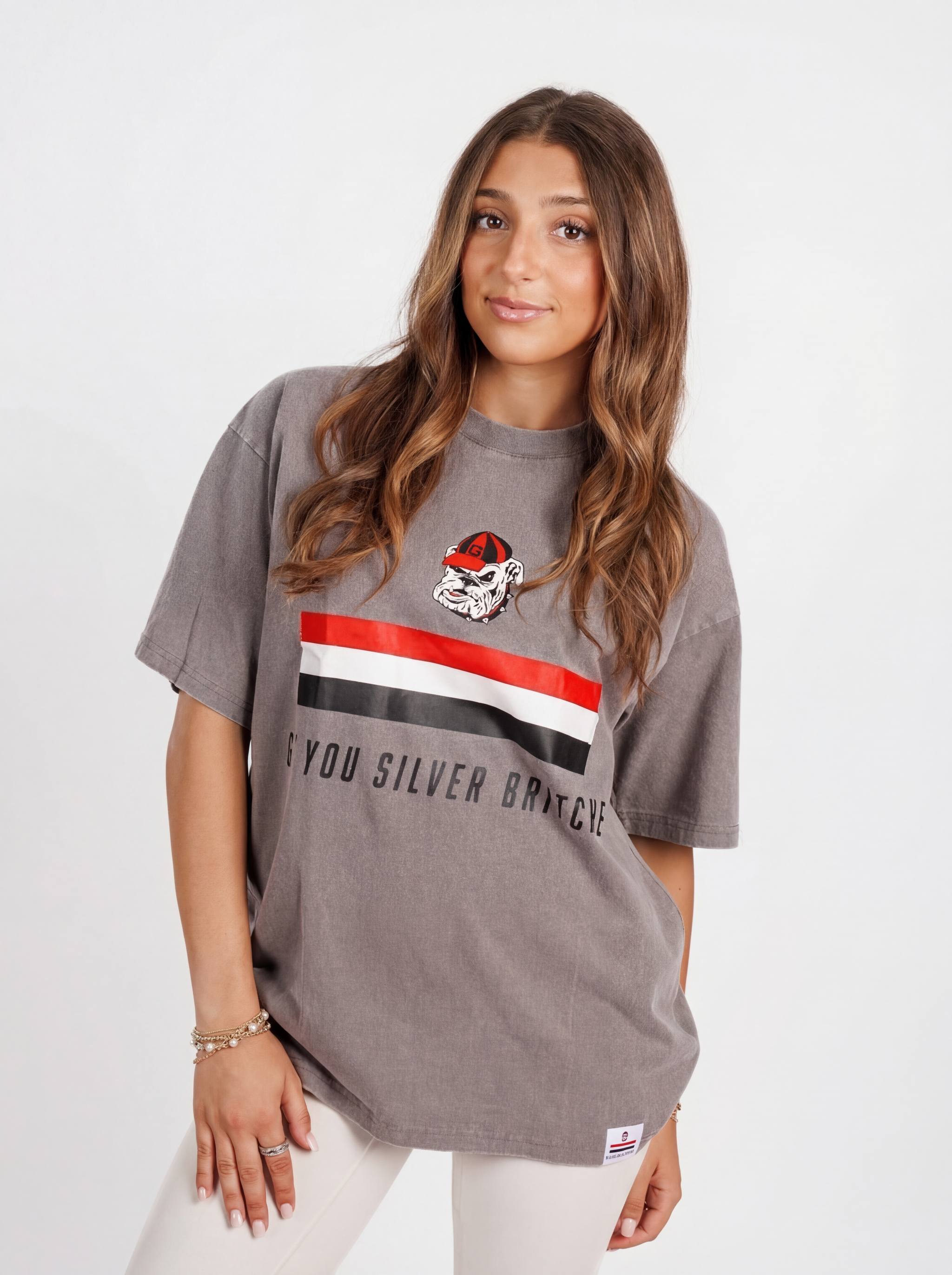 UGA Bulldogs women’s silver "Britches" T-shirt by Arena Graffiti, featuring team logo and athletic style on soft fabric.