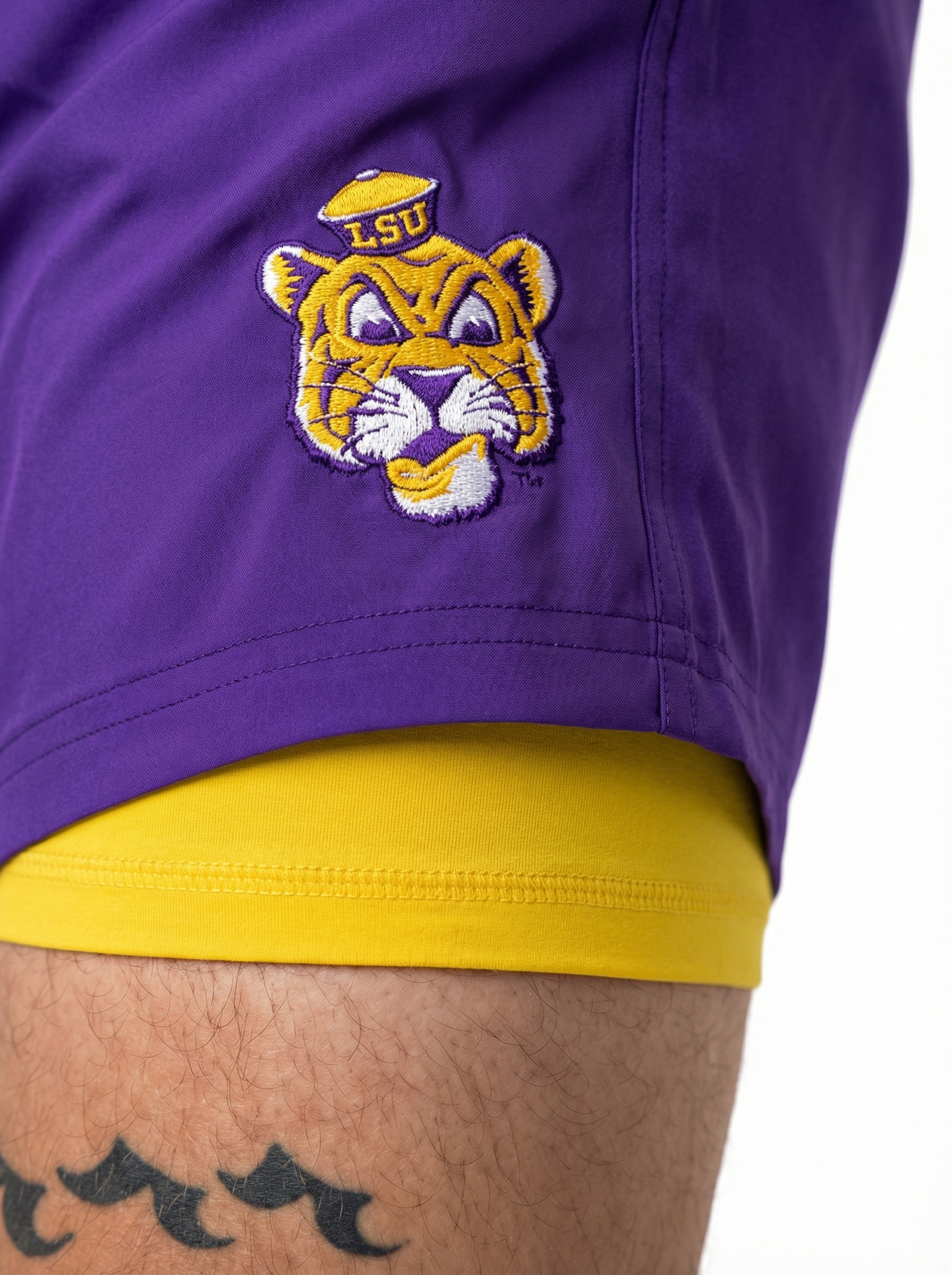 LSU Tigers men's Retro Mike Head lined shorts by Arena Graffiti, showing navy blue shorts with LSU logo and striped waistband.